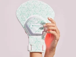 Athlete using Omnilux red light therapy mask for muscle recovery